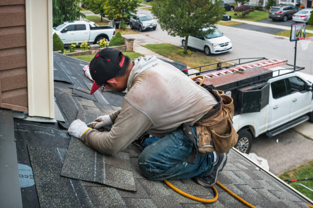 Professional Roofing technician working in Halesite, NY